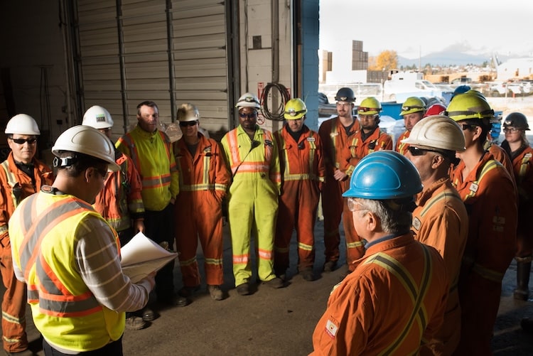 Richmond Steel team of workers huddling to discuss recycling processes.