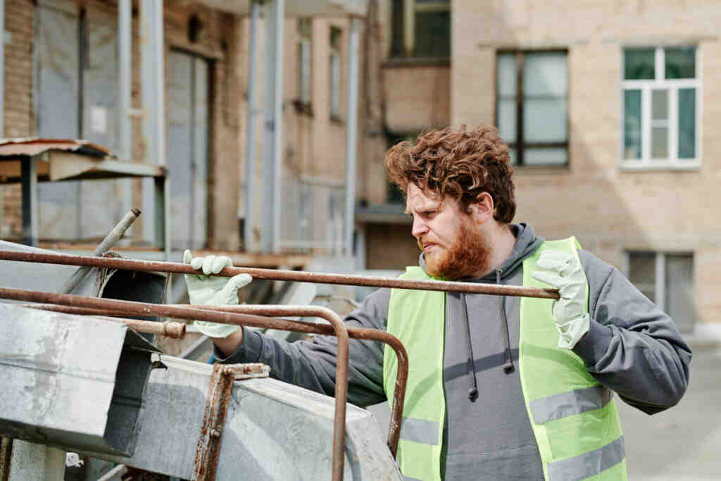 Volunteer Sorting Metal Rods