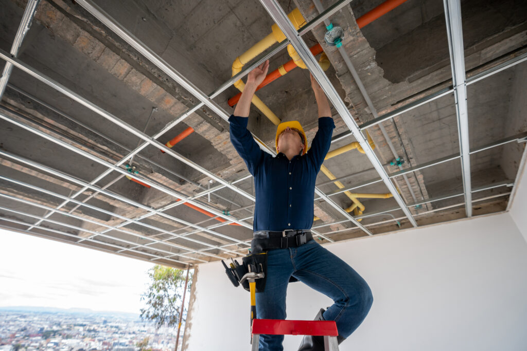 building contractor checking the pipes at a construction site