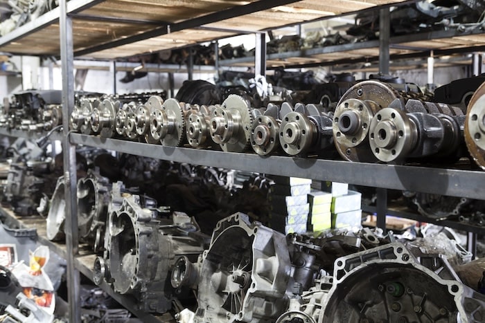 Numerous car engines on shelves